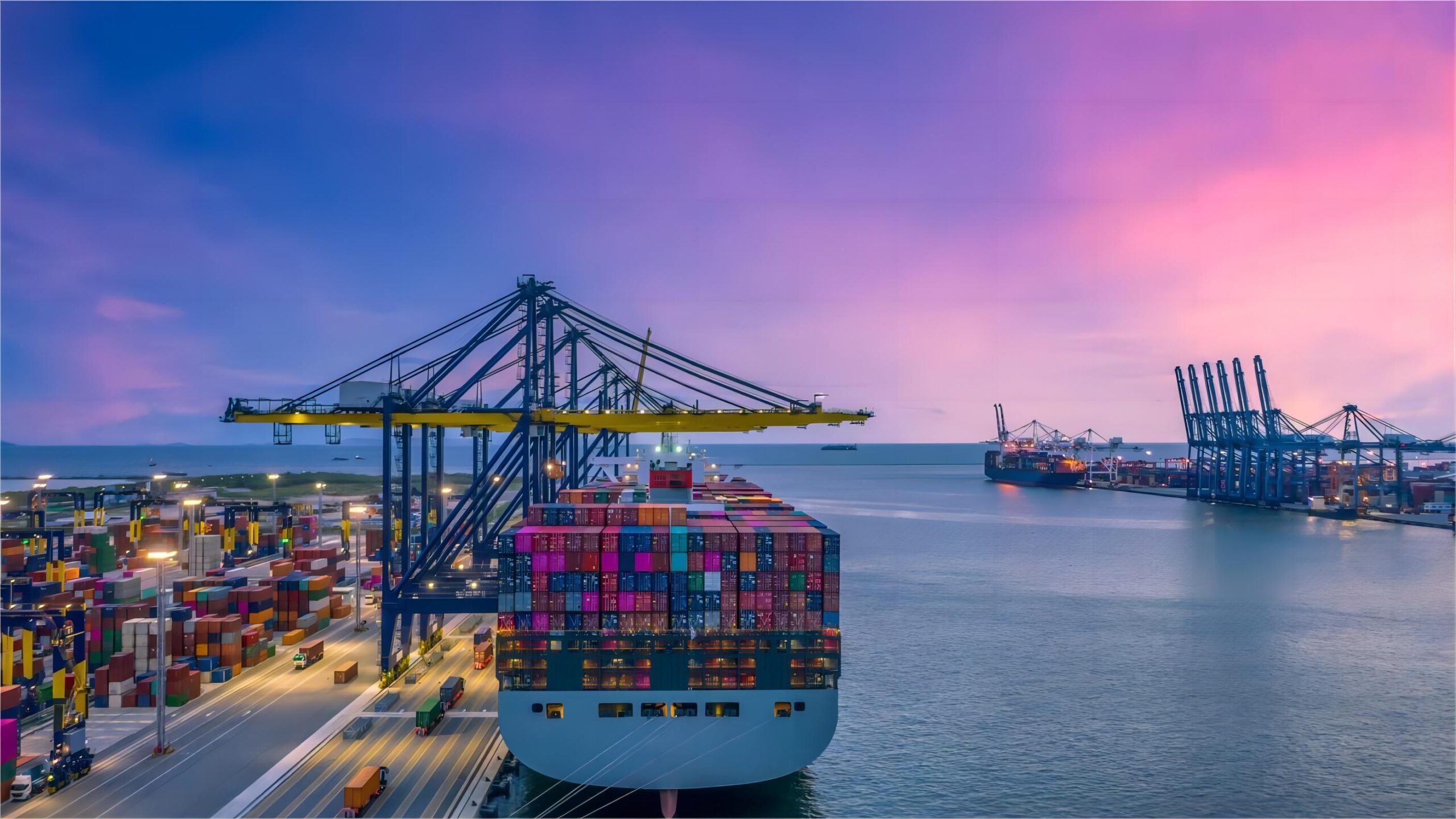Container trucks at a bustling US port, ready for drayage operations.