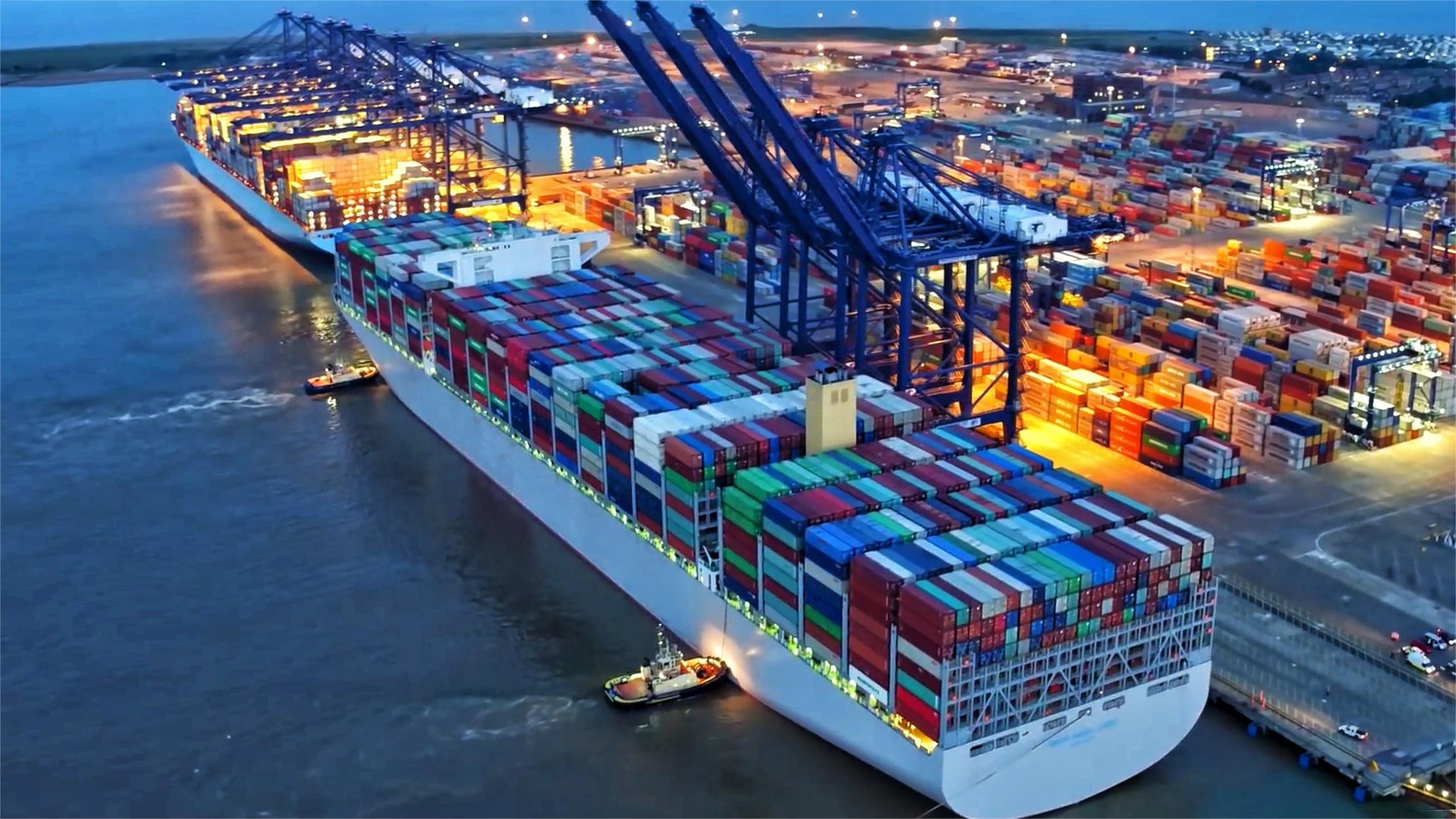 Cargo containers being loaded onto a ship at a port, symbolizing international shipping.